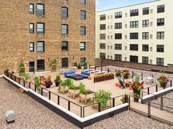 Two spectacular rooftop decks with grills, fire pit, and city views